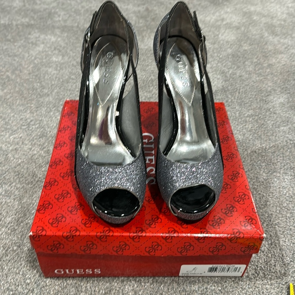 Beautiful ladies, platform Guess high heel shoes size 7.5. Heel height is 5”